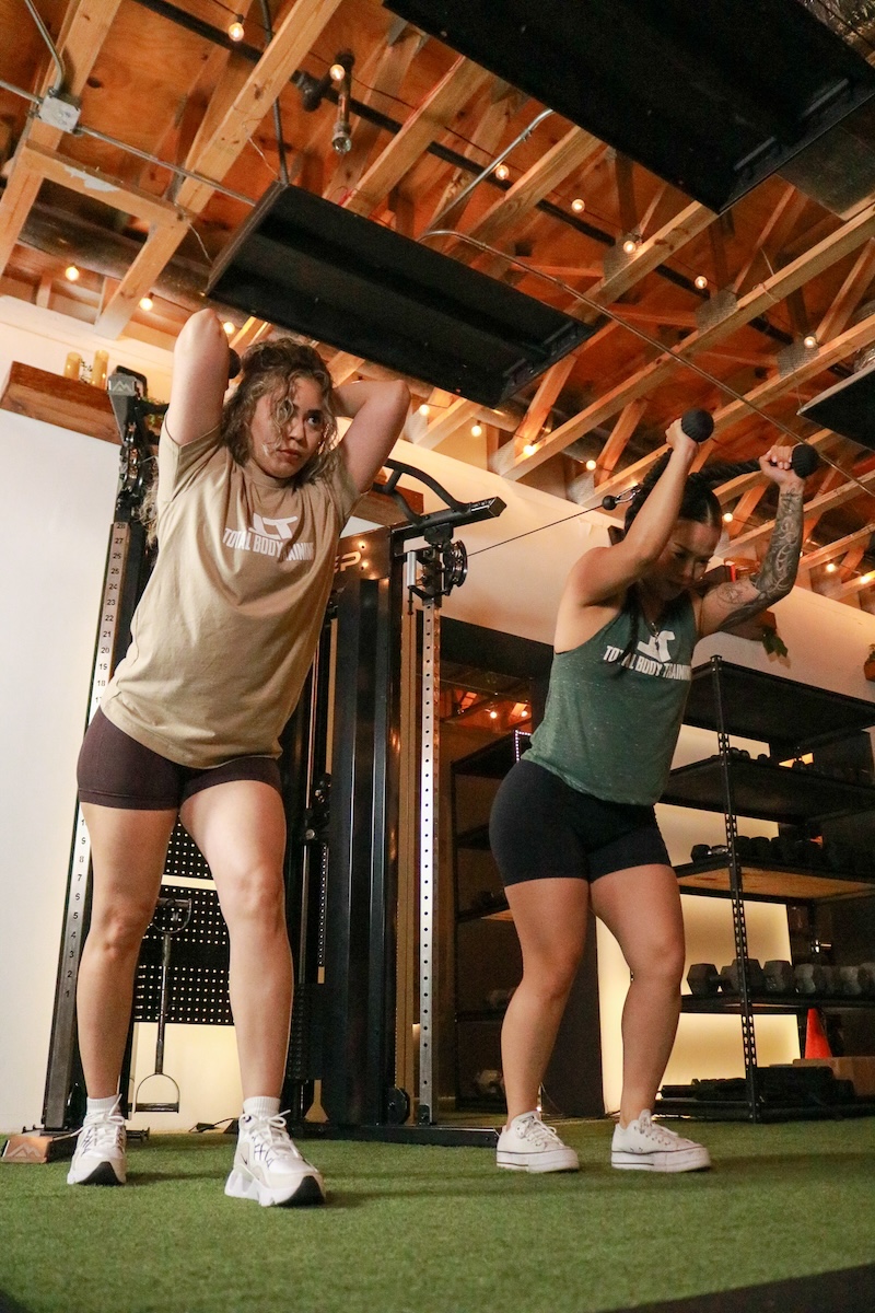 Group Fitness Class Women Smiling While Strength Training